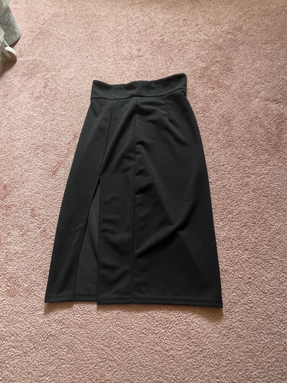 Black high waisted pencil skirt with back zipper and center slit